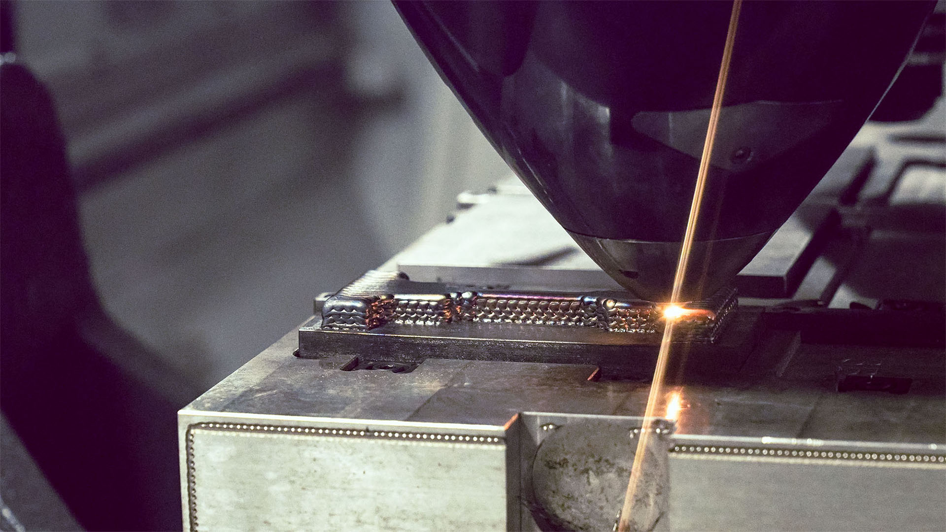 A component being made using wire-laser metal deposition hybrid manufacturing.